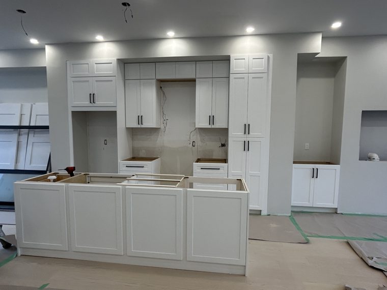 White island and wall cabinets during installation
