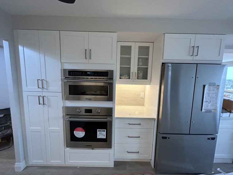 Tall oven pantry and refrigerator cabinetry