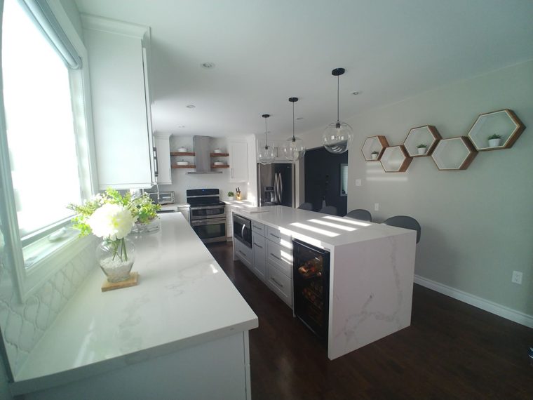Completed kitchen with cabinets and countertops.
