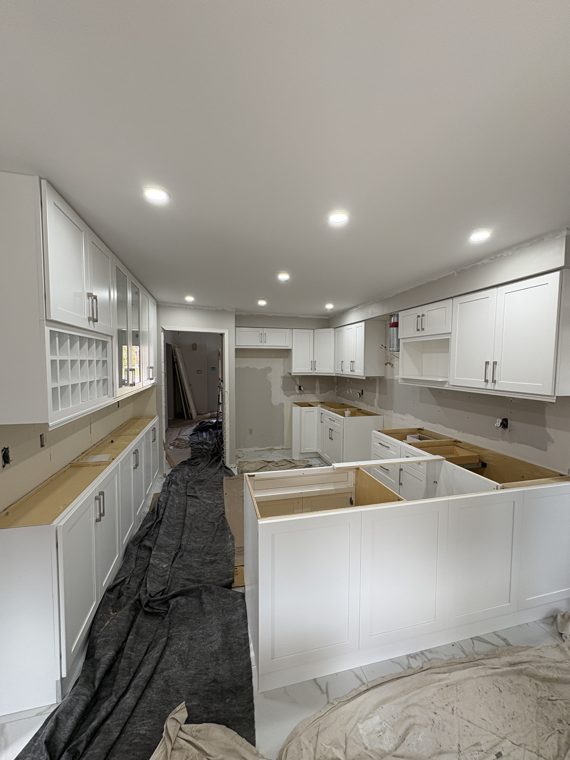 View along cabinet runs before the counters are installed
