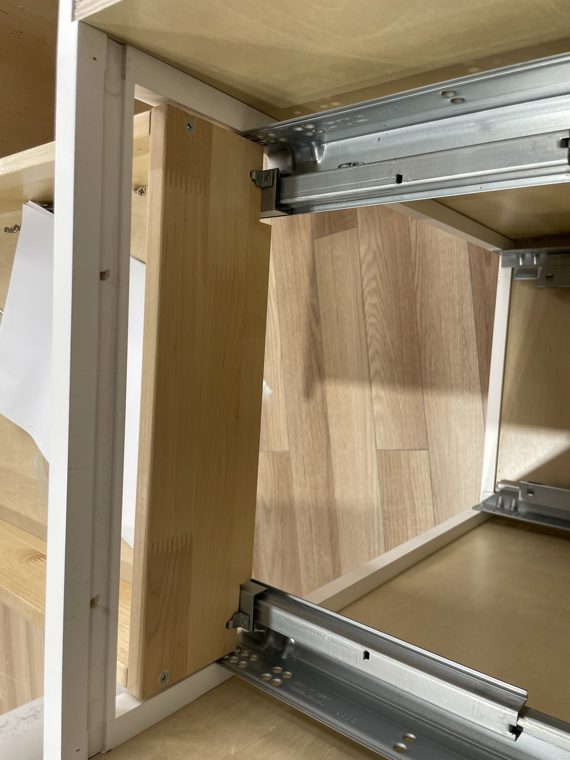 Drawer runners inside a cabinet