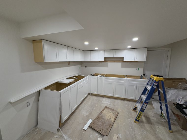White kitchen cabinet runs during installation