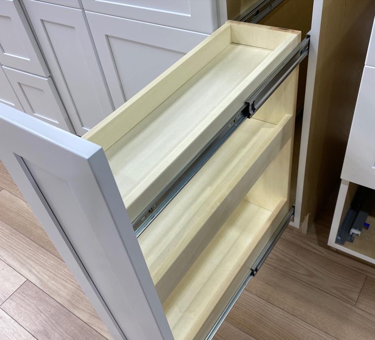 White drawer cabinet with the upper drawer open