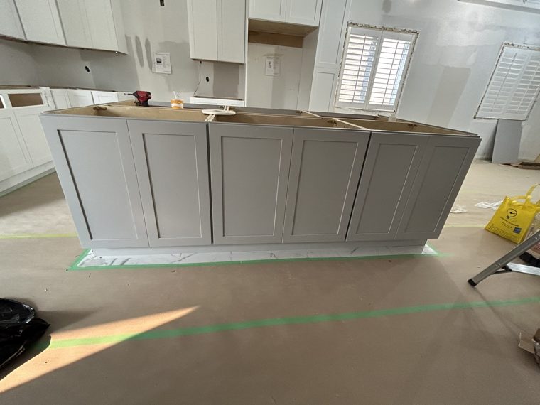 Side panels on a grey kitchen island